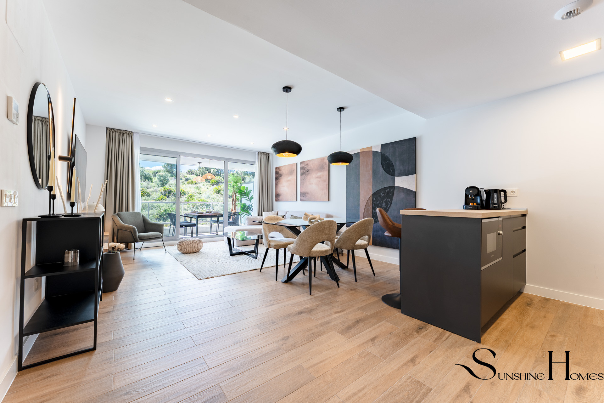 Bright open-plan living room opening onto a garden terrace